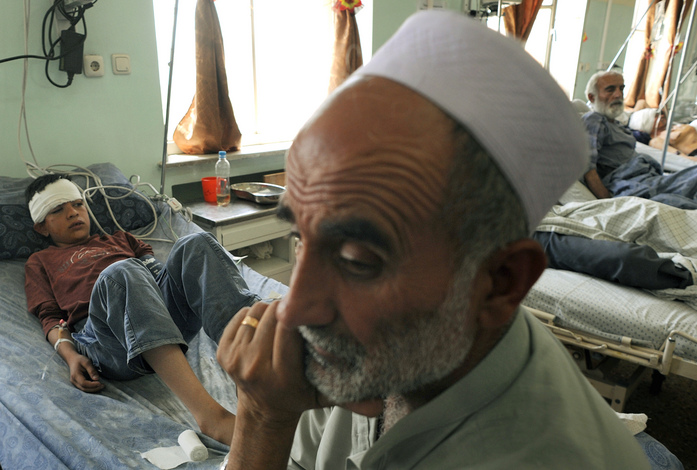 A 12-year-old boy lays injured and bandaged at Wazir Akbar Khan Hospital after the attack in Kabul. If such violence succeeds in scaring voters away from the polls, a low turnout could cast doubts on the legitimacy of the election results.