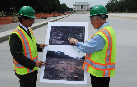 Secretary Salazar with National Park Service Deputy Director for the Mall and Monuments Steve Lorenzetti look over a map of the renovations to the Lincoln Memorial Reflecting Pool.