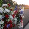 Flowers and a US flag at the Flight 93 Memorial