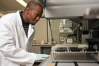 A researcher with sequencing equipment
