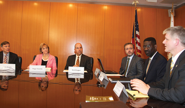 Six of USPTO's leaders sitting around a table