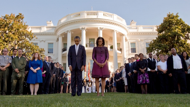 President Obama and First Lady Michelle Obama observe a moment of silence