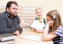 Teacher meeting with parent and student