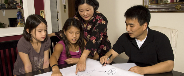 An Asian family makes a fire escape plan