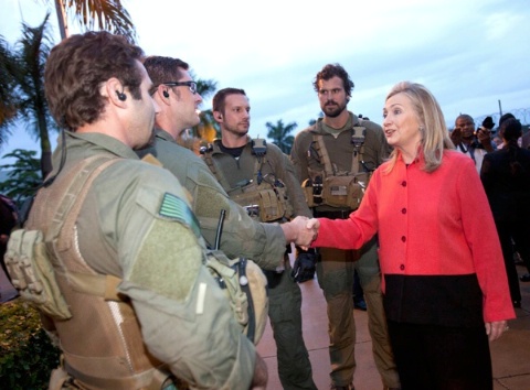 Date: 08/09/2012 Location: Abuja, Nigeria Description: Secretary of State Hillary Rodham Clinton greets members of a Diplomatic Security Mobile Security Deployments team at the U.S. Embassy in Abuja, Nigeria, August 9, 2012. (AP/Wide World Photos/Jacquelyn Martin, Pool) © AP Image