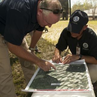 Photo: Slidell, La., Sep. 2, 2012 -- Kevin Hannes (left) a FEMA division coordinator works with Gerald Stolar, FEMA Federal Coordinating Officer to coordinate potential evacuation programs in the Slidell, La., area. FEMA is working with local, state, tribal and other federal agencies to provide assistance to residents affected by Hurricane Isaac.