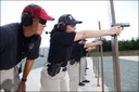 With the help of an FBI instructor, new agents hone their firearms skills at the FBI Academy in Quantico, Virginia.