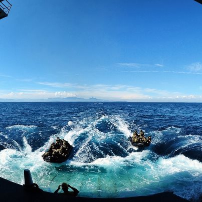 Photo: Photo of the Day: Marines approach the well deck of amphibious dock landing ship USS Tortuga after conducting open ocean operations using combat rubber crafts in Okinawa, Japan, Aug. 25, 2012. The Tortuga is a part of the only forward-deployed amphibious ready group. The Marines are assigned to the 31st Marine Expeditionary Unit. U.S. Navy photo by Seaman Chelsea Mandello