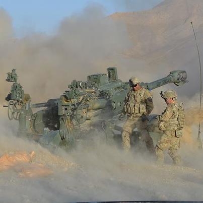 Photo: Photo of the Day: Red Lion soldiers Spc. Fransico Andrade Jr., Spc. Eddie Ocampo and Spc. Patrick Welch of Charlie Battery, 1st Battalion, 37th Field Artillery Regiment, 3rd Stryker Brigade Combat Team, 2nd Infantry Division fire an M-777 howitzer at Forward Operating Base Al Masaak, southern Afghanistan, Aug. 21, 2012. DOD photo by 3rd Stryker Brigade Combat Team, 2nd Infantry Division