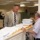 Photo: OFR Director Charley Barth and Prepress Foreperson Mike Abramson view the manuscript for the Federal Register.