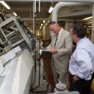 Photo: OFR Director Charley Barth and Bindery Assistant Manager Abe Sussan view printing of the Code of Federal Regulations.