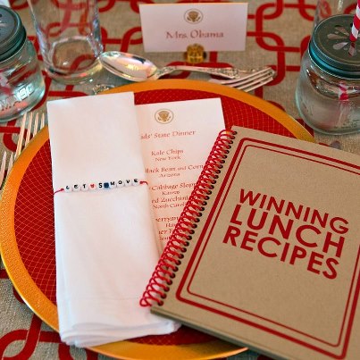 Photo: A booklet of the winning lunch recipes is included as part of the place setting at the Kids’ State Dinner in the East Room of the White House, Aug. 20, 2012. (Official White House Photo by Sonya N. Hebert)