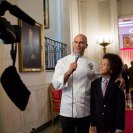 Photo: Sam Kass, Senior Policy Advisor for Healthy Food Initiatives, interviews Kids' State Dinner guest Samuel Hightower, 10, from Maryland, in the Cross Hall of the White House, Aug. 20, 2012. Samuel's winning recipe was for Sizzling Tofu with Green Onions and Sugar Snap Peas. (Official White House Photo by Sonya N. Hebert)