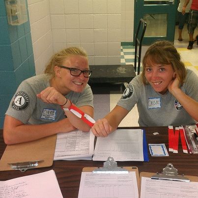 Photo: NCCC - Delta 6 members signing people in at the Hammond Westside Upper Elementary shelter in Hammond, LA.