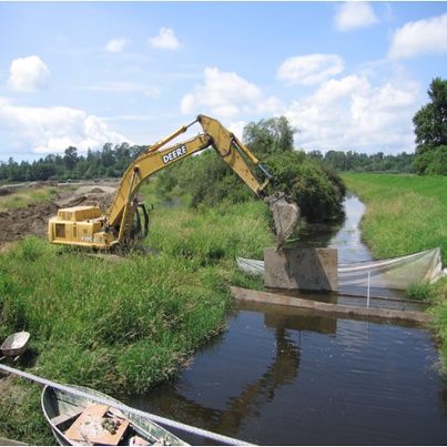 Photo: Washington: Construction underway at the Fisher Slough Marsh Restoration Project. Credit: The Nature Conservancy