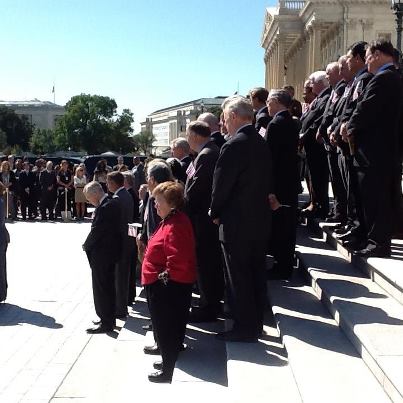 Photo: Senator Akaka and his congressional colleagues pay tribute to the victims of the September 11th attacks today on the Capitol steps