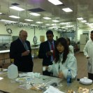 Photo: Dr. Shah and Peter McPherson at a food processing facility in Mississippi.