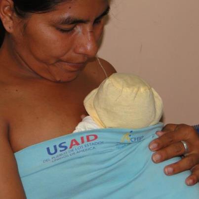 Photo: A new mother holds her baby close to her body as part of a Kangaroo care maternal and child health program in Paraguay. Photo: USAID Paraguay