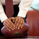 Photo: President Barack Obama leans on a football while making a phone call in the Oval Office on June 24, 2009. (Official White House Photo by Pete Souza)