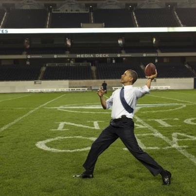 Photo: President Barack Obama throws a football on the field at Soldier Field following the NATO working dinner in Chicago, Ill., May 20, 2012. (Official White House Photo by Pete Souza)