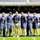Photo: The Leap Frogs pose for a photo with Lee Sicinski, Manager of Events and Entertainment for the Chicago Bears, at Soldier Field, August 17 2012