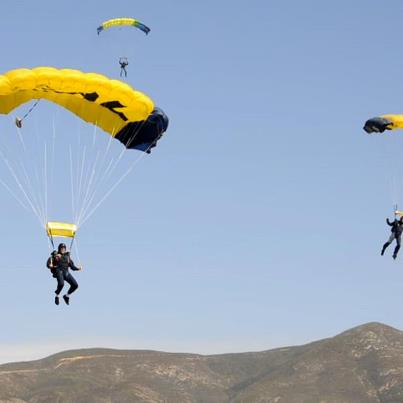 Photo: Vice Adm. Robert Harward, deputy commander, U.S. Central Command, joined the Frogs for some jumps at Otay Lake yesterday. That's him on the left, coming in for a landing with the team. Sound off if you think the admiral should join the team.