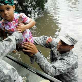 Photo: Sgt. Lee Savoy, a soldier with the 256th Brigade Special Troops Battalion, evacuates a child, Aug. 30, 2012, from the flood waters caused by Hurricane Isaac. The Louisiana National Guard has more than 8,000 Soldiers and Airmen ready to support our citizens, local & state authorities in support of Operation Isaac. (U.S. Army photo by Sgt. Rashawn D. Price, 241st Mobile Public Affairs Detachment, Louisiana Army National Guard/RELEASED)