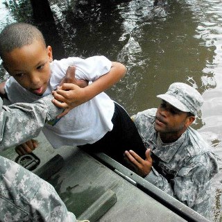 Photo: Sgt. Lee Savoy, a soldier with the 256th Brigade Special Troops Battalion, evacuates a child, Aug. 30, 2012, from the flood waters caused by Hurricane Isaac. The Louisiana National Guard has more than 8,000 Soldiers and Airmen ready to support our citizens, local & state authorities in support of Operation Isaac. (U.S. Army photo by Sgt. Rashawn D. Price, 241st Mobile Public Affairs Detachment, Louisiana Army National Guard/RELEASED)