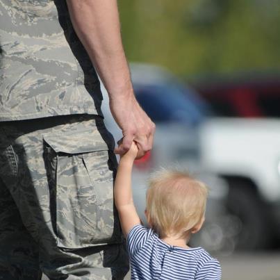 Photo: Photo of the Day: Master Sgt. Donavon Jorissen, of the North Dakota National Guard, walks hand-in-hand with his daughter during Family Day events. Family Day is a semi-annual event when family members get a chance to visit the base during a unit training assembly and are treated to some entertaining activities to show appreciation for their sacrifice and support.