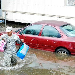 Photo: Sgt. Lee Savoy, a soldier with the 256th Brigade Special Troops Battalion, evacuates a child, Aug. 30, 2012, from the flood waters caused by Hurricane Isaac. The Louisiana National Guard has more than 8,000 Soldiers and Airmen ready to support our citizens, local & state authorities in support of Operation Isaac. (U.S. Army photo by Sgt. Rashawn D. Price, 241st Mobile Public Affairs Detachment, Louisiana Army National Guard/RELEASED)