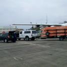 Photo: A Coast Guard Disaster Assistance Response Team from Marine Safety Detachment Cincinnati, Ohio, unloads boats, gear and a truck from a Coast Guard HC-130 Hercules aircraft at Coast Guard Air Station New Orleans, August 30, 2012. The DART joins Coast Guard helicopters from New Orleans, Houston and Mobile, Ala., as they saturate the greater New Orleans area searching for signs of distress and giving assistance as needed. U.S. Coast Guard photo by Petty Officer 1st Class Joel Brown.