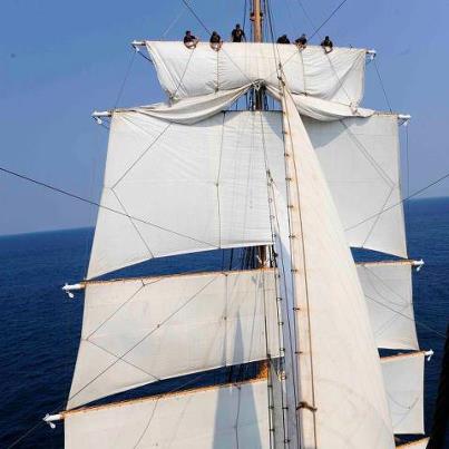 Photo: Was it just us or did this week sail by? Here's United States Coast Guard Barque EAGLE as its crew sets the main royal sail.