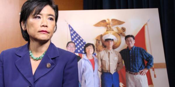 Rep. Chu in front of a photo of her nephew, Harry Lew.