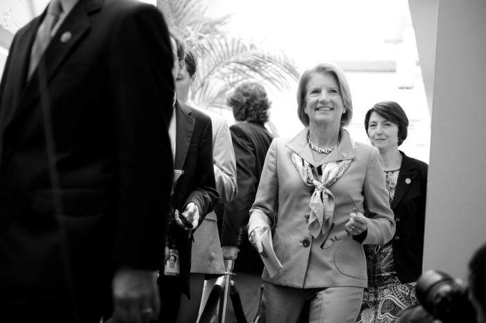 Capito walks to a press conference on over-regulation 