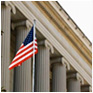 Image of Federalist style building with American flag