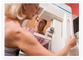 A woman getting a mammogram