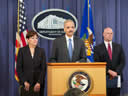 Attorney General Eric Holder flanked by U.S. Attorney Rosa Emilia Rodriguez-Velez, Puerto Rico and FBI Executive Assistant Director Shawn Henry announces the results of Operation Guard Shack – the largest police corruption investigation in FBI history.