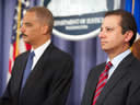 U.S. Attorney for the Southern District of New York Preet Bharara, and Attorney General Eric Holder wait to address the nation.