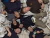 Inside 16.5-ton H-II Transfer Vehicle (HTV-3), also known as Kounotori3, the six members of the Expedition 32 crew pose for a 
