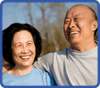 smiling older man and woman outdoors