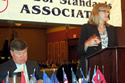 WHD's Nancy Leppink addresses the Interstate Labor Standards Association while Gary Preachy, ILSA President, looks on. Click on the photo for a larger image and caption.