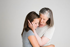 image of mother consoling daughter