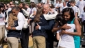 The President, First Lady and Vice President hug Olympians.