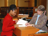 Photo of patron at reference desk.