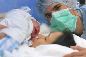 man and woman during a c-section