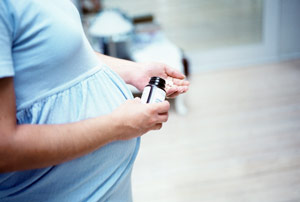 pregnant woman taking pills
