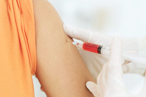 woman getting a shot in the arm