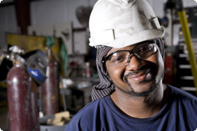 Man Wearing Safety Goggles and Hat