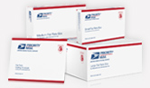 image of four small and large white USPS boxes