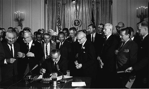 President Lyndon B. Johnson signs the Civil Rights Act of 1964, July 2, 1964.